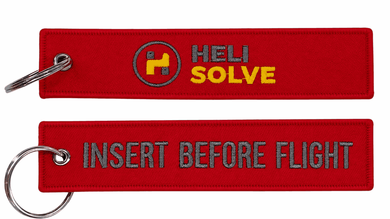 Red remove before flight key chains